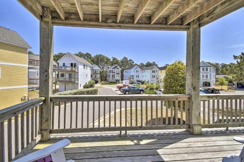 a wooden porch with a view of a street at Home with Deck in Corolla Light Walk to Beach! in Corolla