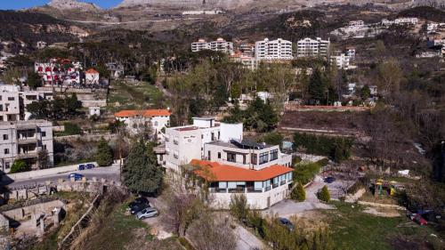 an aerial view of a building in a city at Rami Hotel in Fālūghā