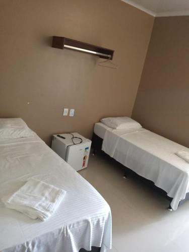Una cama o camas en una habitación de HOTEL LISBOA