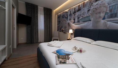 En eller flere senge i et værelse på Borghi di Belmonte