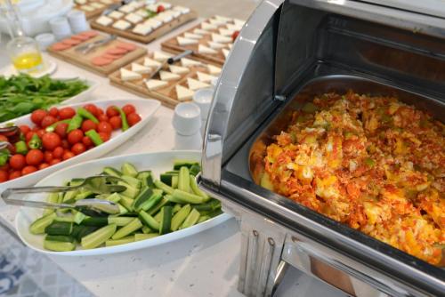 a buffet of food with vegetables on a table at Arnna Hotel in Kas