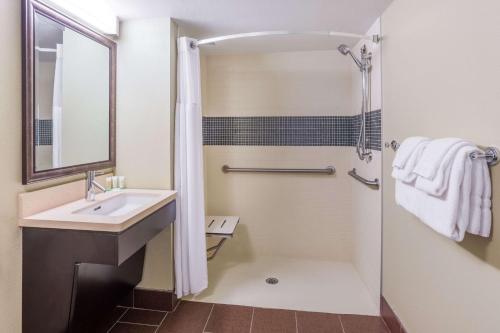 a bathroom with a sink and a shower at Sonesta ES Suites Atlanta Perimeter Center in Atlanta