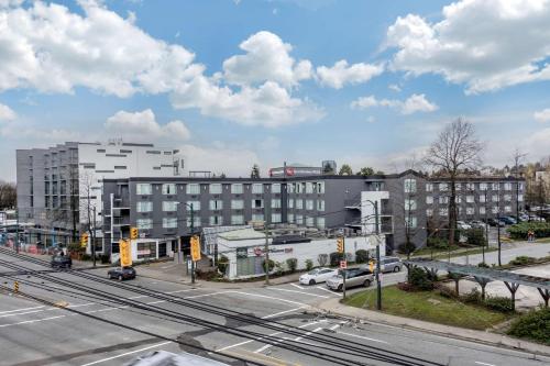 an aerial view of a city with a building at Best Western Plus Vancouver Airport Hotel in Vancouver