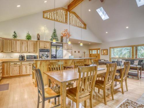 a large kitchen with wooden tables and chairs at Barlow Trail Lodge - Meredith Lodging in Rhododendron