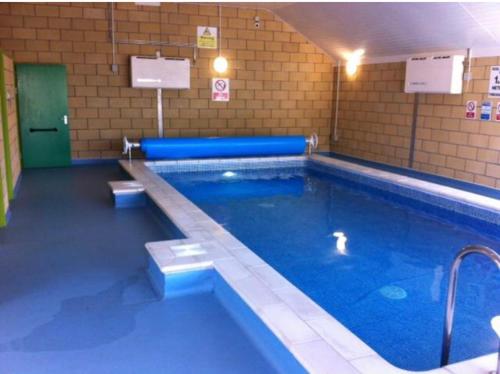 a large swimming pool in a building at AJL Rentals in Turnberry
