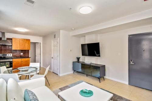 a living room with a white couch and a table at Bright stylish &great location 2bd Apartment in Philadelphia