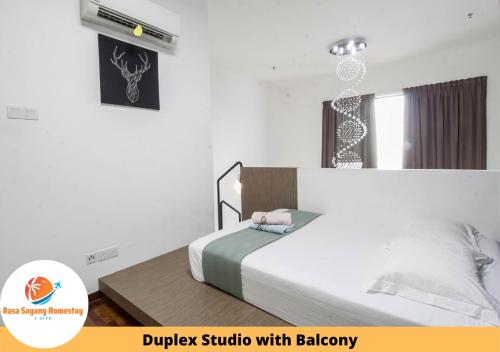 Ένα ή περισσότερα κρεβάτια σε δωμάτιο στο Rasa Sayang Homestay @ I-Soho, I-City