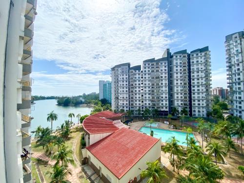 a view of a resort with a river and buildings at BayView Suites Port Dickson By MAISON in Port Dickson