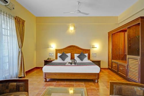 Rúm í herbergi á The Fort Manor Hotel - Kochi Kerala