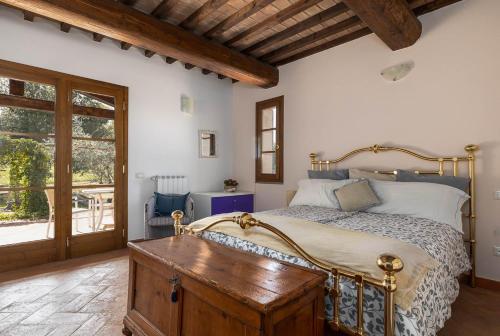 Postel nebo postele na pokoji v ubytování Villa Montegemoli - by Bolgheri Holiday