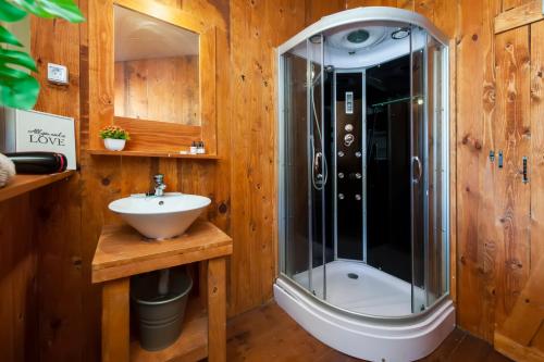 a bathroom with a shower and a sink at Holiday Centre Bi VIllage - Glamping and Mobile Homes Lavanda in Fažana