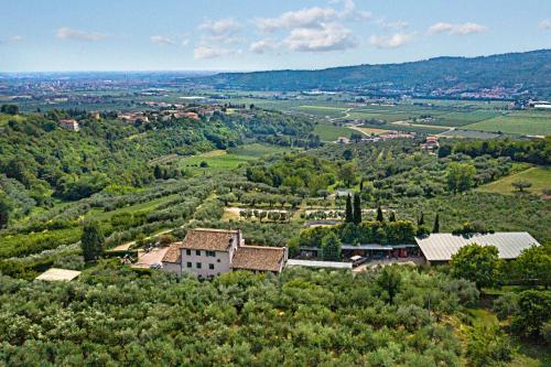 an aerial view of a house on a hill at Agriturismo Casa Rosa in Verona