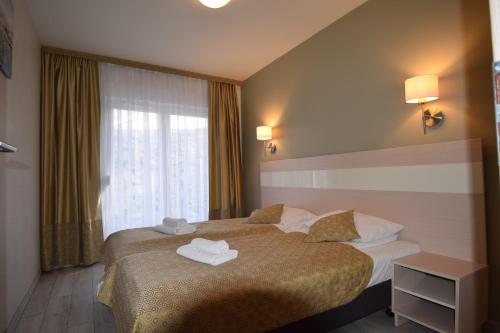 Postel nebo postele na pokoji v ubytování Apartament Czarna Gora Is6