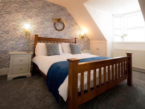 מיטה או מיטות בחדר ב-Sandpiper Cottage