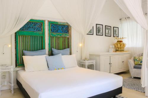 Ένα ή περισσότερα κρεβάτια σε δωμάτιο στο Chanteak Bali - White House 1
