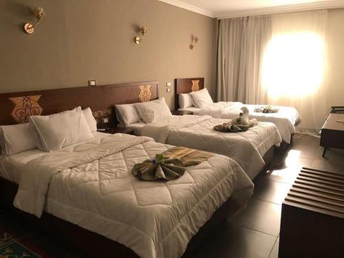 Postel nebo postele na pokoji v ubytování Town View Hotel