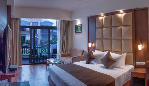 Postel nebo postele na pokoji v ubytování Trinantara Resort & Spa