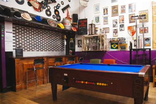a pool table in a room with a bar at Belford Hostel in Edinburgh