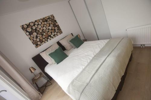 Un pat sau paturi într-o cameră la Ravenbosch 5 ppl