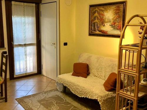 a living room with a couch and a ladder at B&B Il Parco in Parma