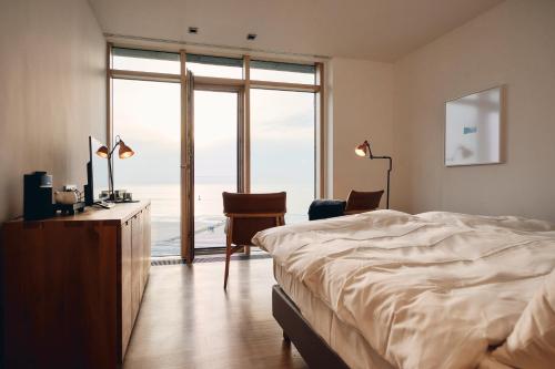 Cama o camas de una habitación en Hotel Haus am Meer
