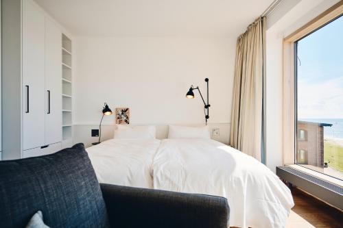 Cama o camas de una habitación en Hotel Haus am Meer