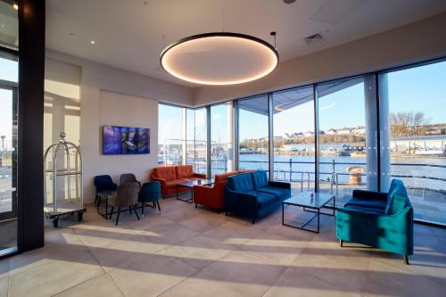 a living room with a view of the water at Tŷ Milford Waterfront in Milford Haven