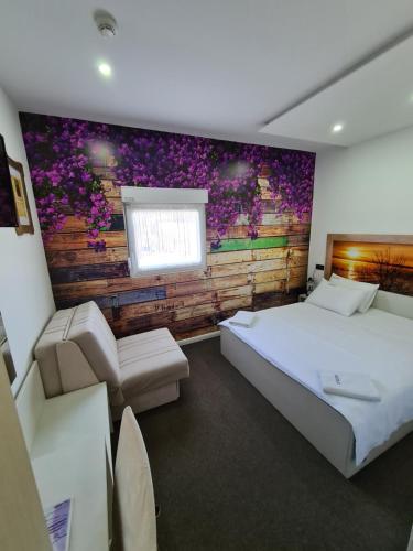 Postel nebo postele na pokoji v ubytování Garni Hotel & Spa Nicolo