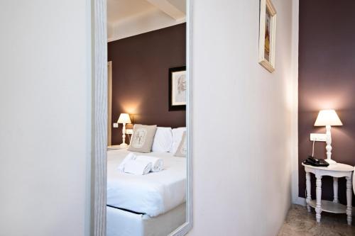 Hotel Broletto - Centro Storicoにあるベッド
