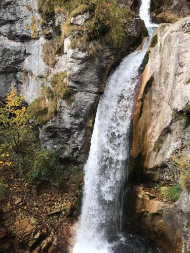 a waterfall on the side of a rocky cliff at Ferienwohnung Kusternik in Velden am Wörthersee