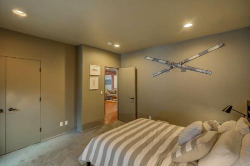 a bedroom with a large bed with a clock on the wall at Mackinaw Manor by Casago McCall - Donerightmanagement in McCall