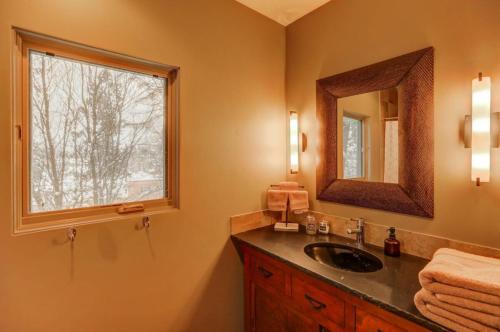 a bathroom with a sink and a window at Mackinaw Manor by Casago McCall - Donerightmanagement in McCall
