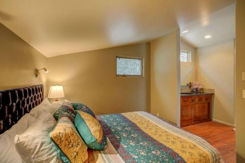 a bedroom with a bed with pillows on it at Mackinaw Manor by Casago McCall - Donerightmanagement in McCall