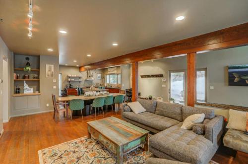 a living room with a couch and a table at Mackinaw Manor by Casago McCall - Donerightmanagement in McCall
