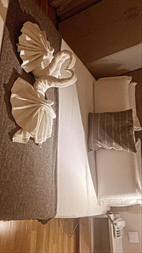 a close up of a bed with towels on it at Hotel Excelsior in Lisbon