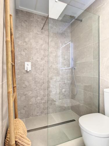 a bathroom with a glass shower with a toilet at Ribera Nature Villa - 7209 in Santiago de la Ribera
