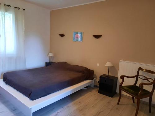 Ένα ή περισσότερα κρεβάτια σε δωμάτιο στο Cottage les Verveines de Vaison