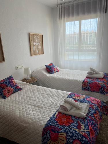 Lova arba lovos apgyvendinimo įstaigoje Apartamento con Vistas al Mar 1ºA