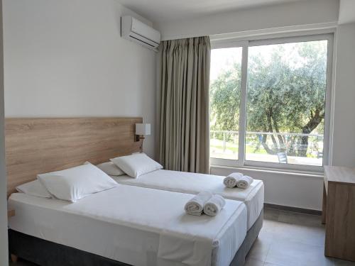 Postel nebo postele na pokoji v ubytování Saint Nicholas Hotel