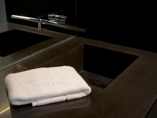 a towel sitting on a counter next to a sink at Landescape Furnas in Furnas