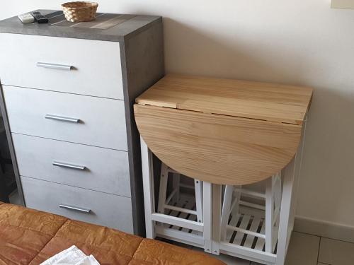a stool next to a dresser next to a desk at ele&gio accomodation in Tropea