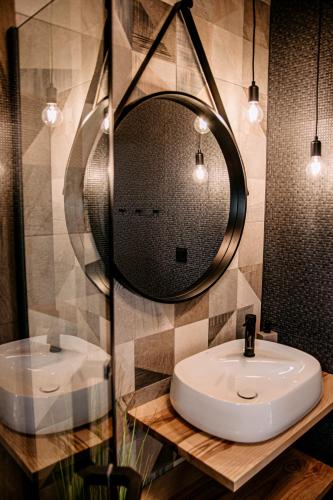 a bathroom with a sink and a mirror at Rajderówka in Krzyżowa
