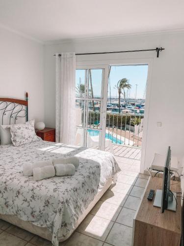 a bedroom with a bed and a view of the ocean at Pasito Blanco Holiday Home - Casa Yairan in Pasito Blanco