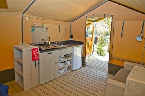 a kitchen inside of a tent with a sink at Fellow Du Nord in Goebelsmuhle