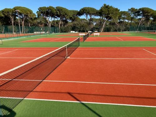 a tennis court with two tennis courts at CALYPSO in Biograd na Moru