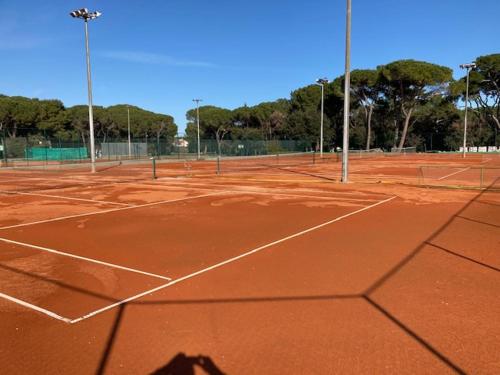 a tennis court with two tennis nets on it at CALYPSO in Biograd na Moru