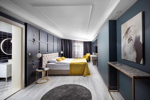 a hotel room with a bed and a bathroom at B LOFT HOTEL in Bursa