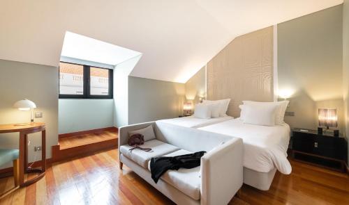 A bed or beds in a room at Pousada de Lisboa - Small Luxury Hotels Of The World