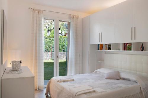 En eller flere senge i et værelse på Appartamento Zerboni C1