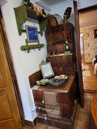 a room with many wooden trunks on a wall at Vila Magnolia in Curtea de Argeş